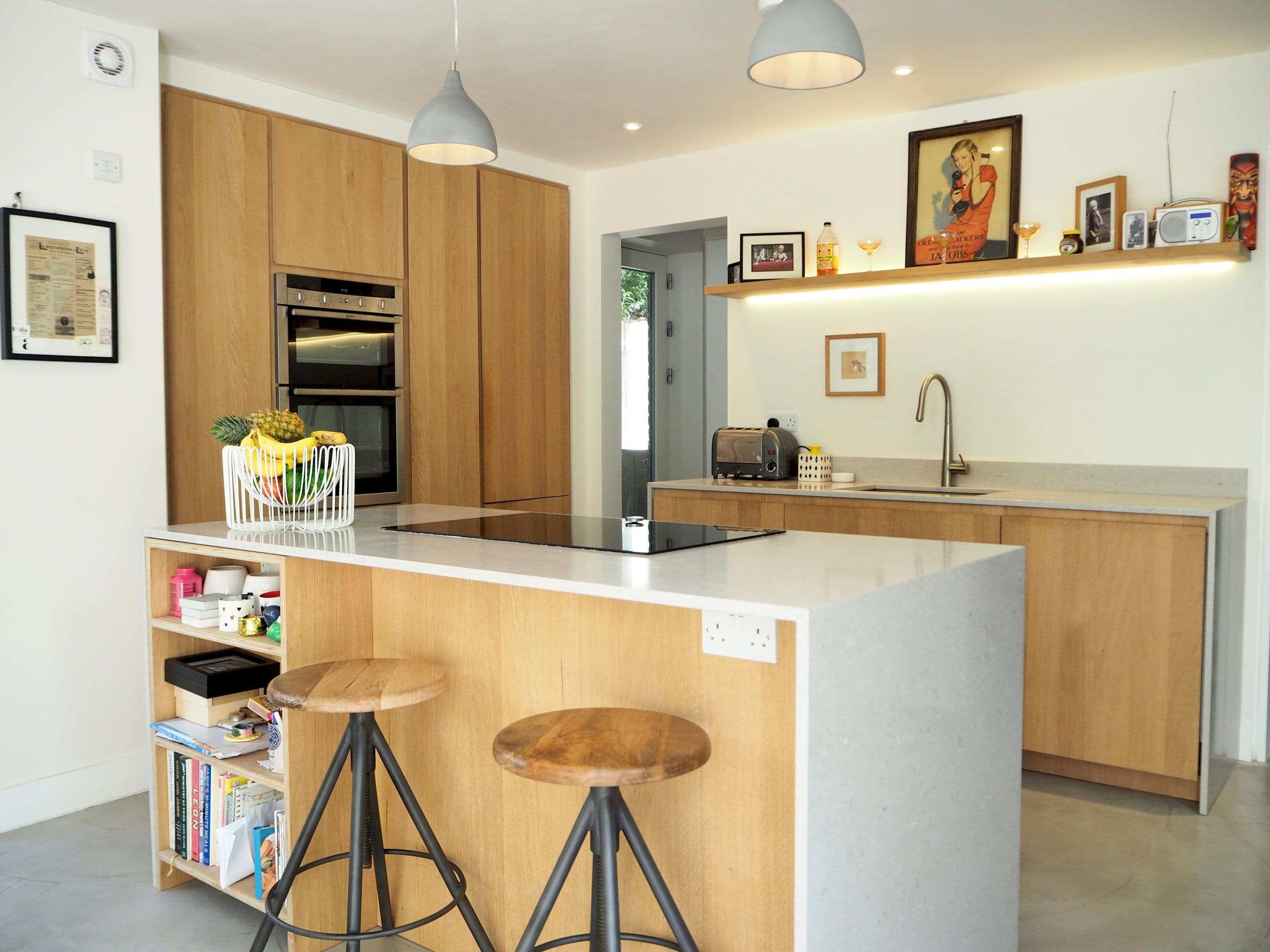 Solid wood modern handless kitchen with stone worktop