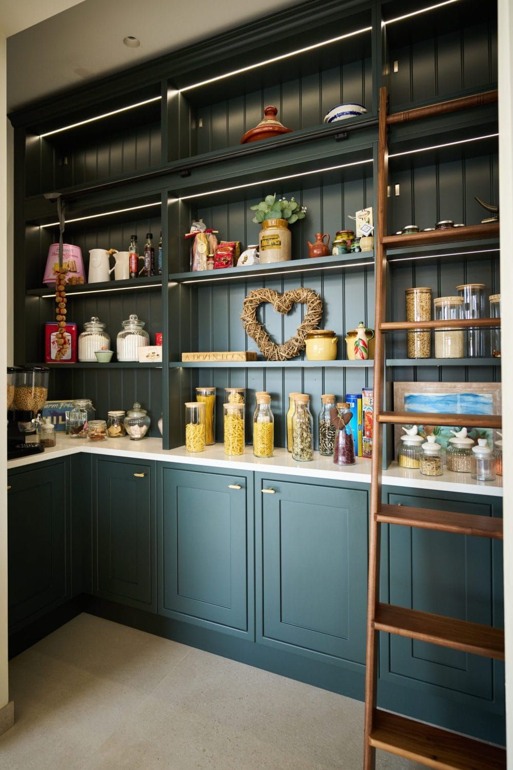 walk in pantry with walnut shelf